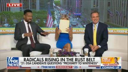 Lawrence Jones, Ainsley Earhardt covering her laughter by holding a folder in front of her face, and charlie hurt