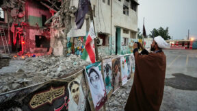 cleric takes a photo at school in iran reportedly bombed by the us