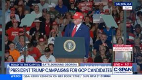 Trump at podium in red hat at georgia rally oct 16 2026 Dividend GA